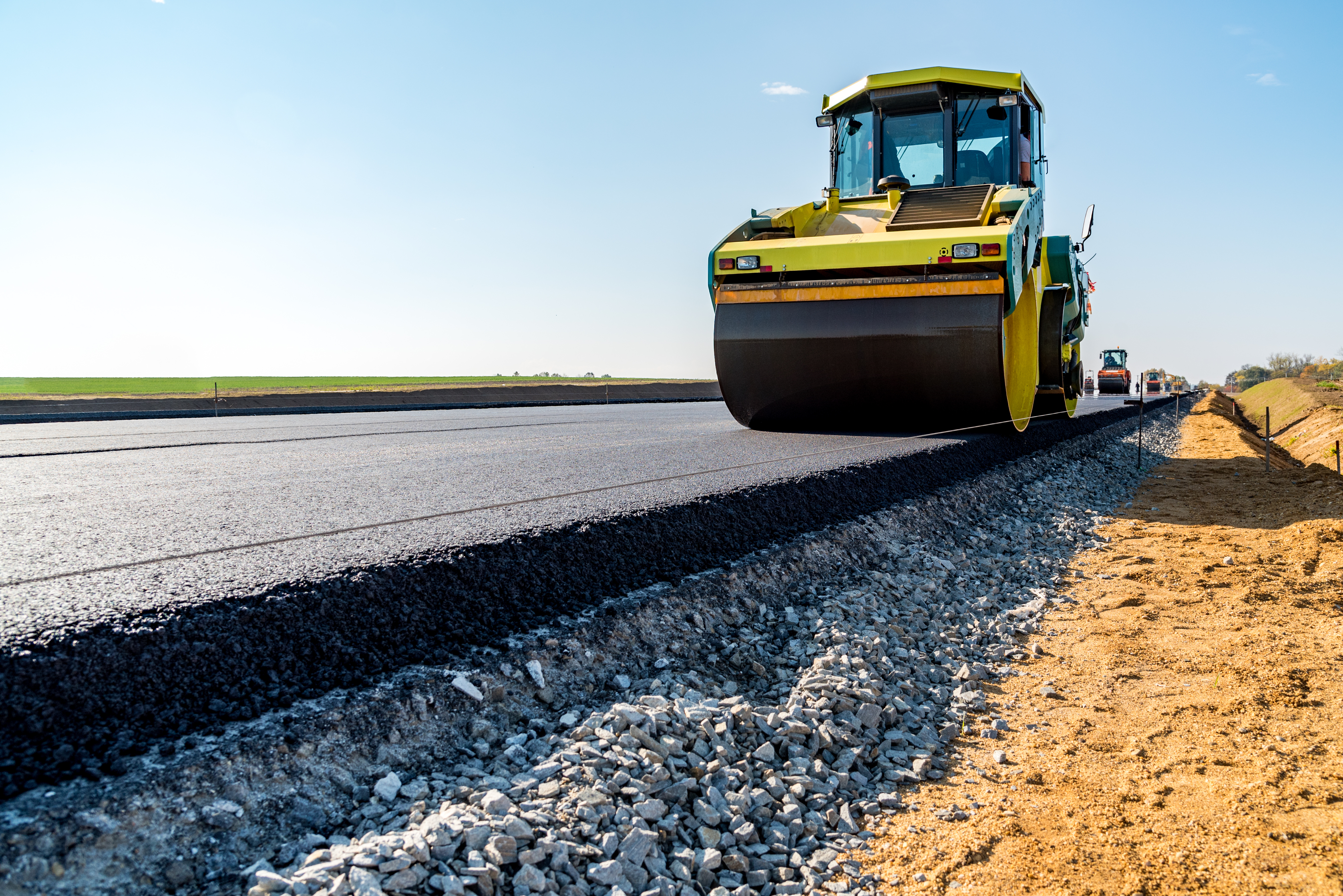 Road rollers building the new asphalt road